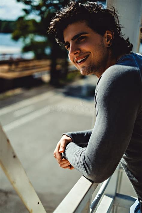 Handsome Man Smiling While And Looking Far Away Stock Photo Image Of