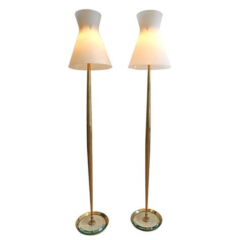 It can be fun to decorate a room with dramatic dark colors. 1stdibs - Pair of Standing Lamps by Max Ingrand/Fontana ...