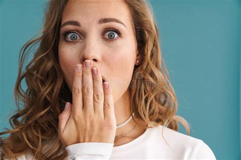 Blonde Shocked Woman Covering Her Mouth And Looking At Camera Stock