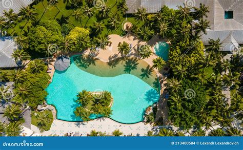Aerial Photo Of The Swimming Pool Among Buildings And Trees At The
