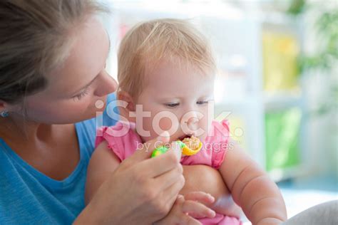 Cute Baby Eating Stock Photo Royalty Free Freeimages