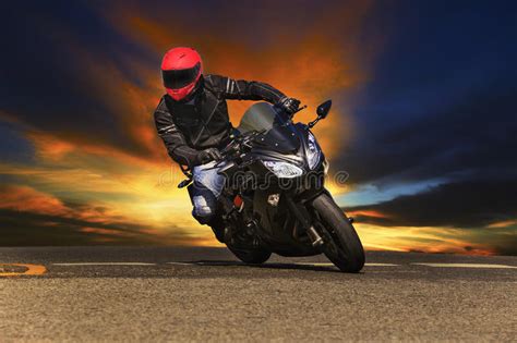 Young Man Riding Big Bike Motorcycle On Asphalt Roads Stock Image