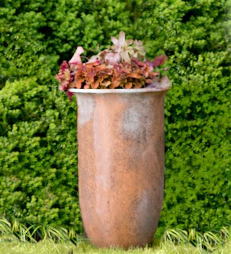 Tall Rust Colored Stone Planter Wind And Weather