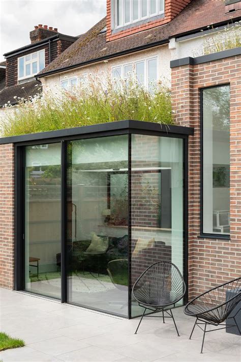 Glass box extensions are very popular extension types for houses and buildings all over the uk. small-glass-box-extension-with-ceiling-planters | HomeMydesign