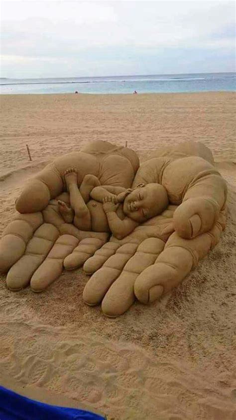 he has you in the palm of his hand sand sculptures