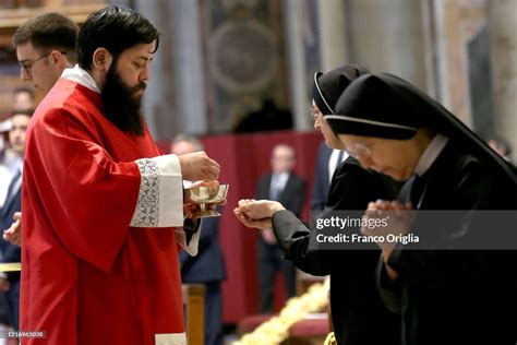 Nuns Take The Communion During Pope Francis Palm Sunday Mass In An