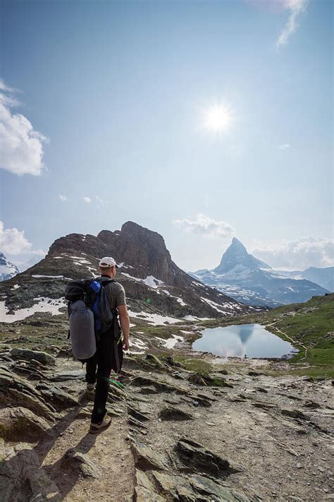 Hiker In The Swiss Alps Near By Matteo Colombo