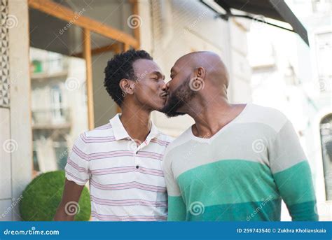 Close Up Of African American Gay Men Kissing In Street Stock Photo