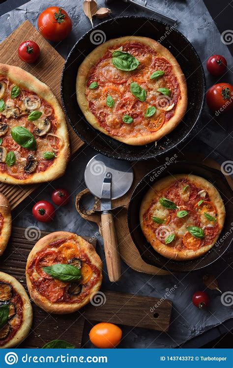 Flatlay Of Vegetarian Pizza Party Homemade Rustic Pizzas With Tomatoes