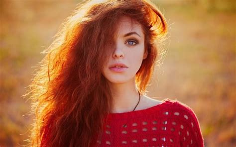 The attributes that differentiate one individual from another arise from variations in the genome. women, Blue eyes, Redhead, Sweater, Sunlight, Looking at ...