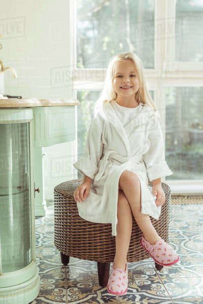 Full Length View Of Beautiful Little Girl In Bathrobe Smiling At Camera