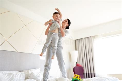 Happy Mother With Son In Bed At Home Or Hotel Room Stock Image Image