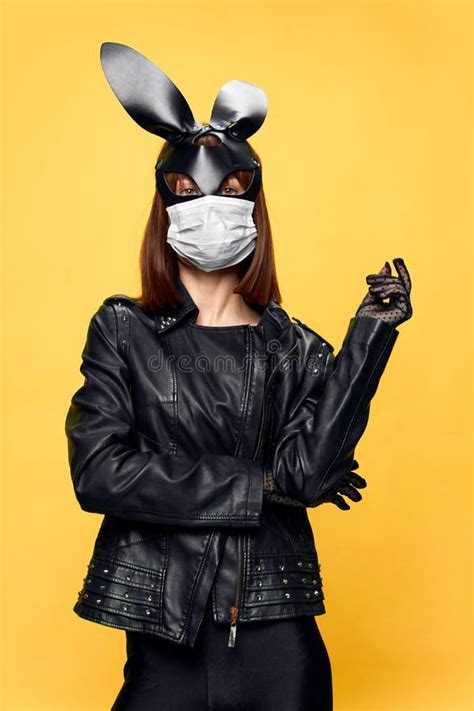 Female Rabbit Mask Posing Sexually In A Medical Mask From Coronavirus