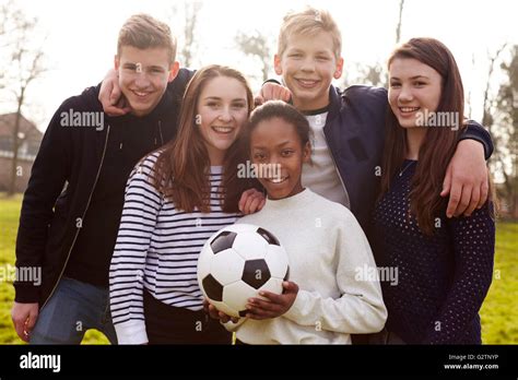 Portrait Of Teenagers Playing Soccer In Park Together Stock Photo Alamy