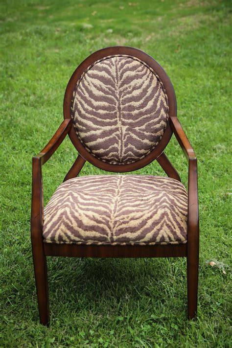 Events lately have seen a leopard print takeover. sweetpickins: Zebra print fabric and wood arm chair