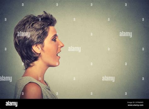 Closeup Side View Profile Portrait Woman Talking With Sound Coming Out Of Her Open Mouth