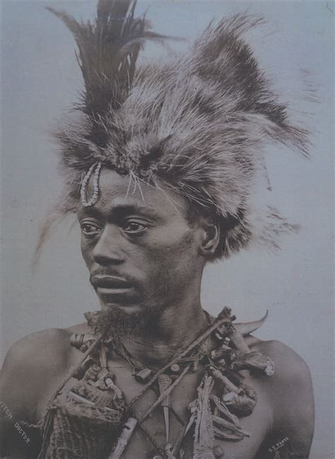 African Warrior With Elaborate Fur And Feather Head Dress