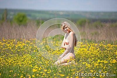 Beautiful Girl Nude In Field With Yellow Flowers Royalty Free Stock