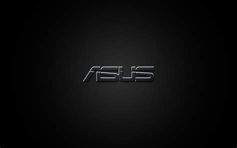 The Asus Logo Is Shown In Black And Silver On A Dark Background With