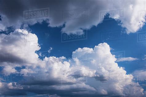 Puffy Clouds On Sky Stock Photo Dissolve