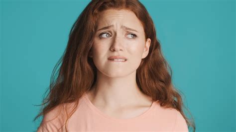 Free Photo Disappointed Anxious Redhead Girl Nervously Biting Lips