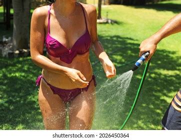 Beautiful Spanish Woman Sprayed Water Hose Stock Photo