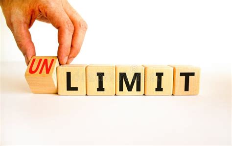 Limit Or Unlimit Symbol Businessman Turns Wooden Cubes And Changes The