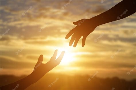 Premium Photo Silhouette Of Giving A Helping Hand Hope And Support