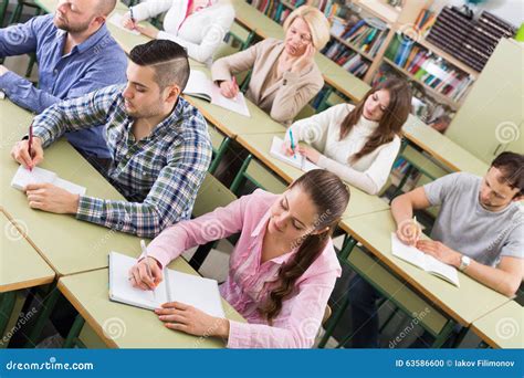 Adult Students Writing In Classroom Stock Photo Image Of Learning