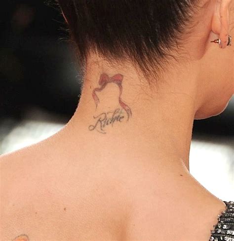 Cross has to do with spirituality and religion, especially it is related to christian faith and belief. Victoria Beckham and more stars with neck tattoos | Gallery | Wonderwall.com