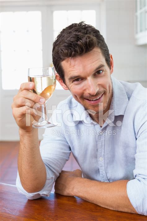 Smiling Young Man Holding A Wine Glass Stock Photo Royalty Free
