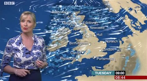 Carol Kirkwood Puts On Very Busty Display As She Squeezes Assets Into Plunging Blue Blouse