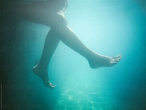 female legs underwater by stocksy contributor visualspectrum stocksy