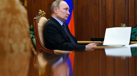 putin signs law allowing him two more terms as russia s leader nz