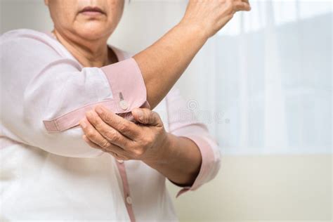 Elbow Pain Old Woman Suffering From Elbow Pain At Home Healthcare