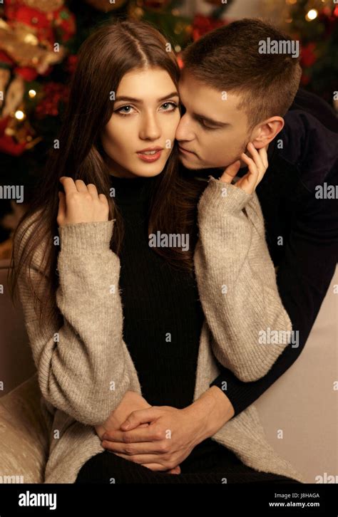 Young Romantic Cute Couple Staing At Home And Enjoying Time Together Lovers Hugging In Cristmas