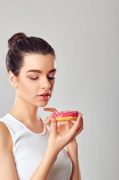 Premium Photo Close Up Portrait Of A Hungry Girl Eating Desserts