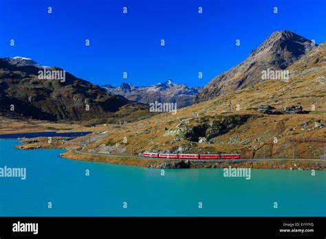 Rhaetian Railway At The Bernina Pass At Lago Bianco Switzerland