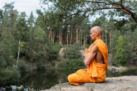 Buddhist Monk In Orange Kasaya Meditating Stock Photo Image Of Orange