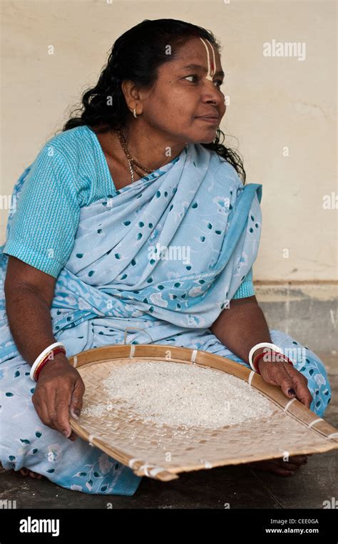 Woman Sifting Rice Vrindavan Hi Res Stock Photography And Images Alamy