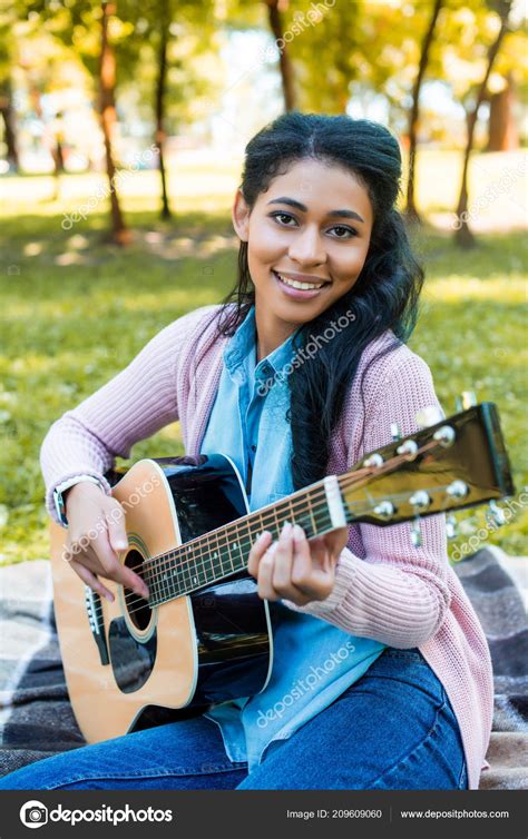 Beautiful African American Woman Playing Acoustic Guitar Park Looking