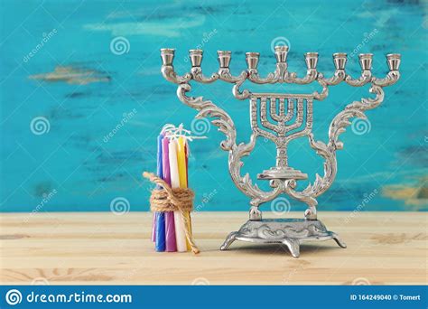 religion image of jewish holiday hanukkah with menorah traditional candelabra and spinning top