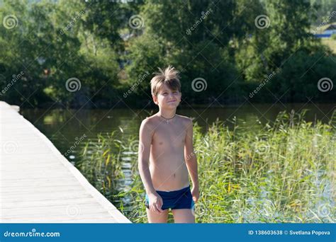 13 Years Old Boy Swimming And Relaxation In The Sea Waves Concept Of