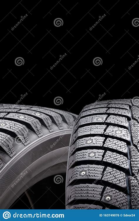 New Winter Studded Tires Isolate On A Black Background Conceptfront