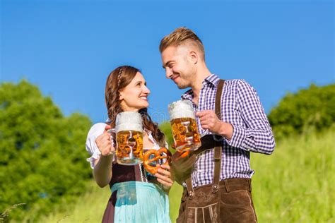 German Couple In Tracht With Beer And Pretzel Stock Image Image Of