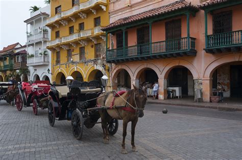 Horse Carriages On Plaza De Los Coches In Cartagena Colombia A Walled