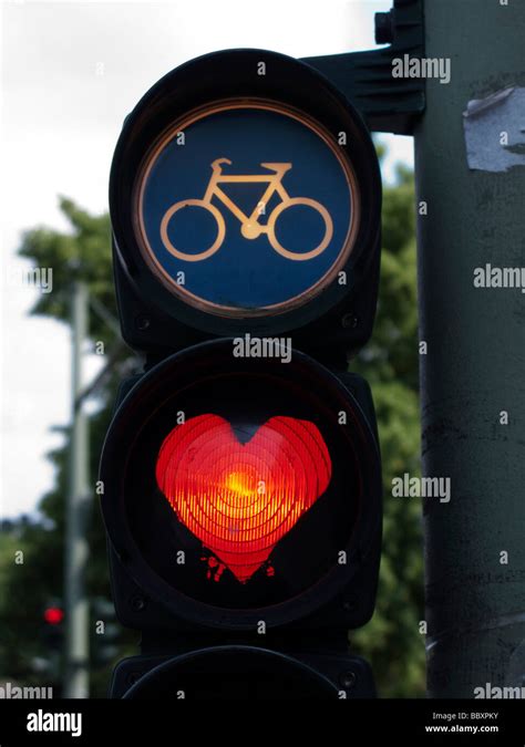 Traffic Lights For Cyclists With Red Light Painted Into A Heart Shape