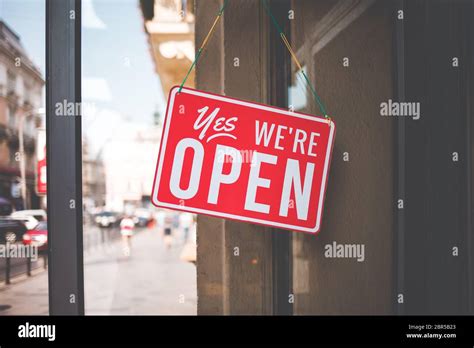 Yes Were Open Sign On The Glass Of The Doors In Store Welcome Sign At