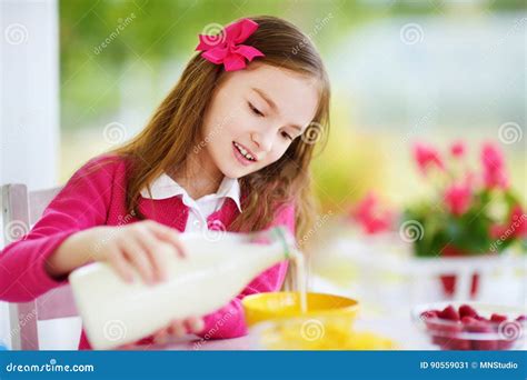 Cute Little Girl Enjoying Her Breakfast At Home Pretty Child Eating