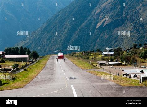 Helicopter Landing On The Dangerous And Tiny Lukla Airstrip In The